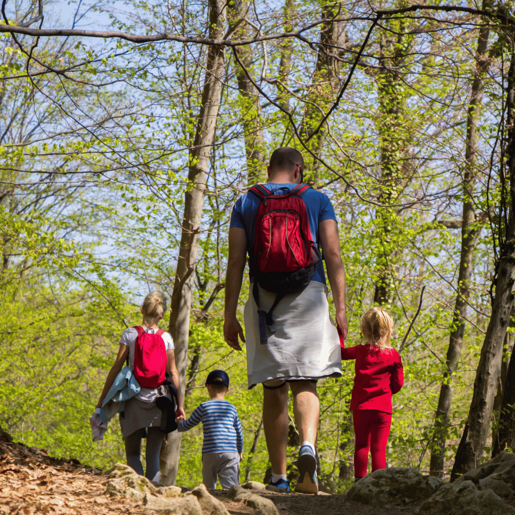 CHIRYO Outcomes and Intervention Services father mother son and daughter walking in the forest woods