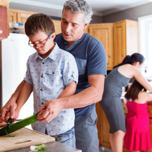 CHIRYO Outcomes and Intervention Services house male adult support autistic child to food preparation female staff helping female child to wash hands
